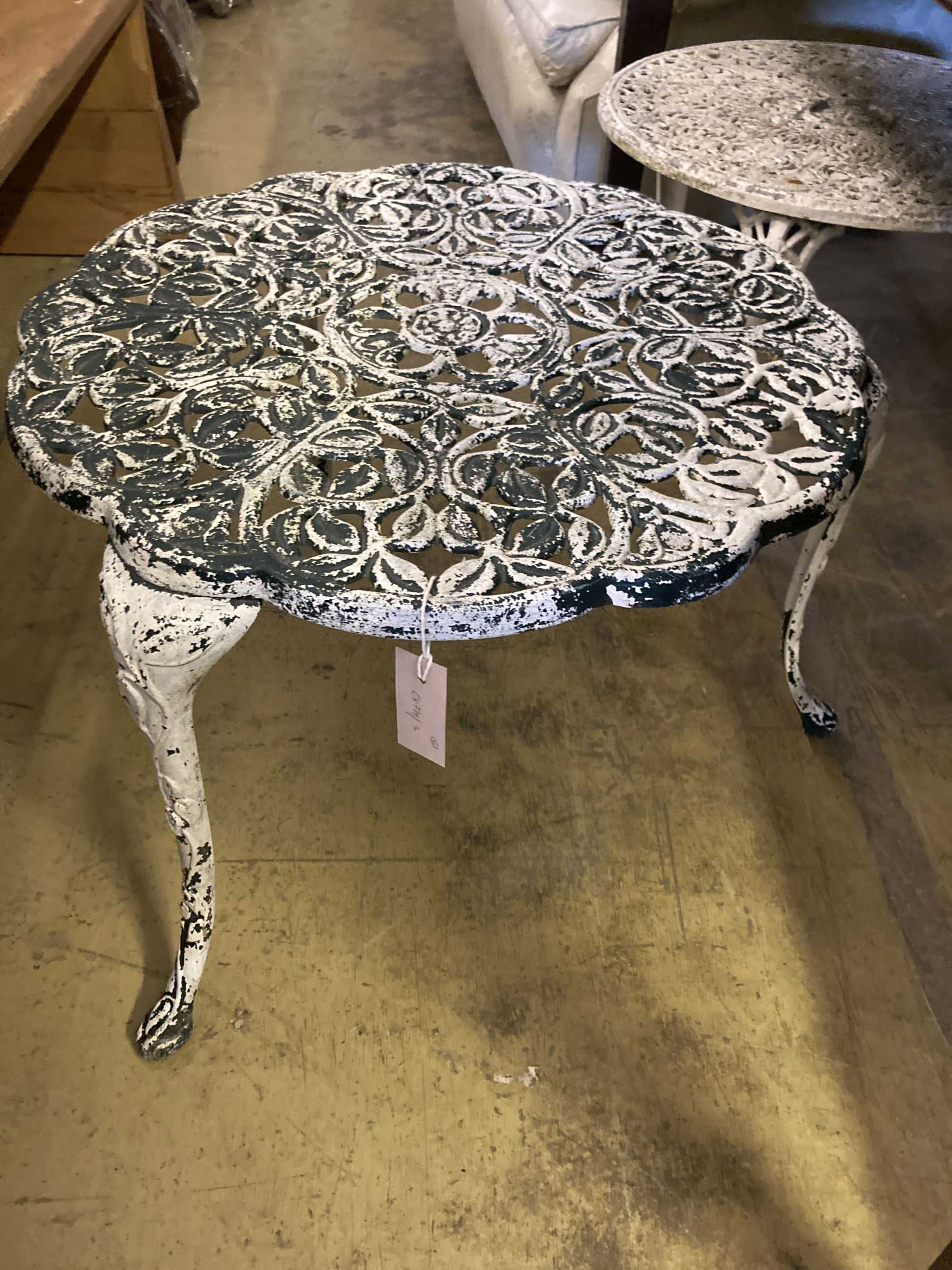 A pair of painted circular aluminium garden tables, larger 61cm diameter, height 44cm